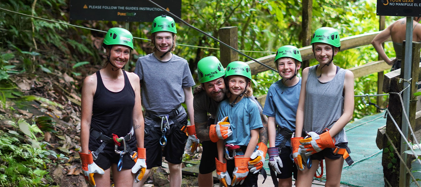 Family and guides ready for a canyoning adventure with Pure Trek in La Fortuna, Costa Rica rainforest.