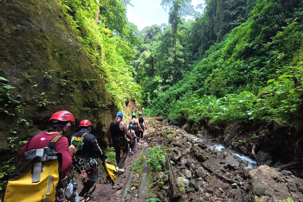 canyoning group hiking rainforest falls arenal costa rica jungle adventure